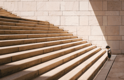 boy at the bottom of stairs